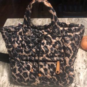 MZ Wallace leopard print small back back with cosmetic bag included.